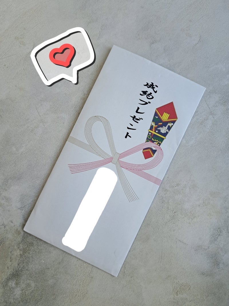 母が挑んだ新車の100円玉つかみ取りの画像